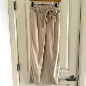 Express tan skinny leg high-waisted trousers.